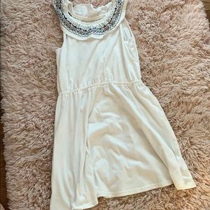 A white dress with blue design